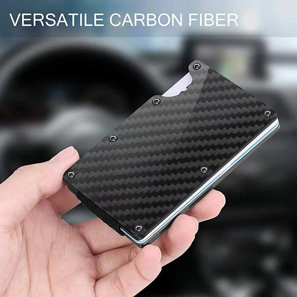 A hand holds a black carbon fiber card holder wallet with a textured pattern.