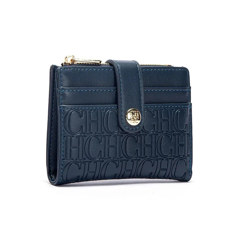A dark blue leather square folding wallet with gold hardware and embossed text.