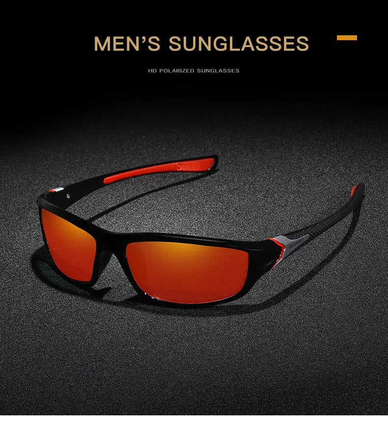 Un par de gafas de sol polarizadas con tinte naranja, apoyadas sobre una superficie oscura.