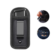 Black universal inside-the-waistband magazine holster for concealed carry featuring a magazine and retention strap.