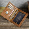 A brown genuine leather passport card holder displaying various cards and a passport document.