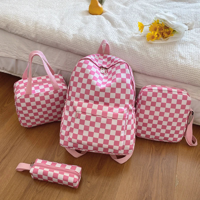 A pink and white checkerboard multi-pocket backpack is displayed on a wooden surface next to a small zippered pouch.