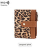 A brown leopard print wallet with a leather strap and zipper protection.