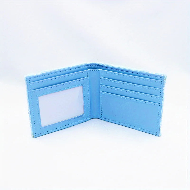 A light blue fabric wallet with a clear window and embroidered details shown open.