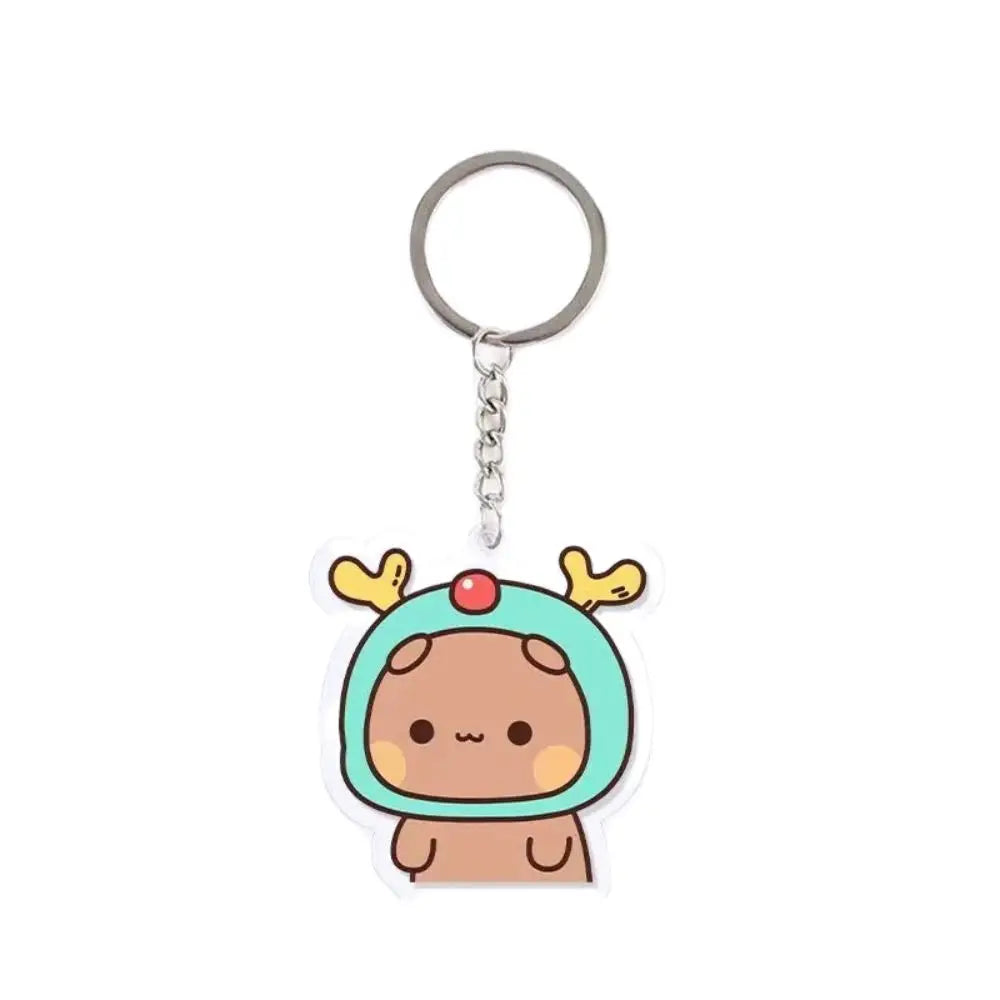 A cute cartoon character keychain charm featuring a brown face and green ears on a clear resin background.