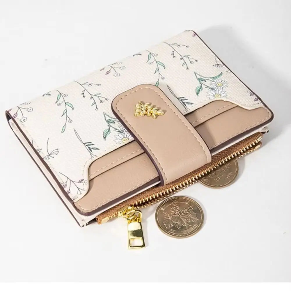 A beige fashion PU leather slim card holder wallet with a floral pattern and gold-toned coins.