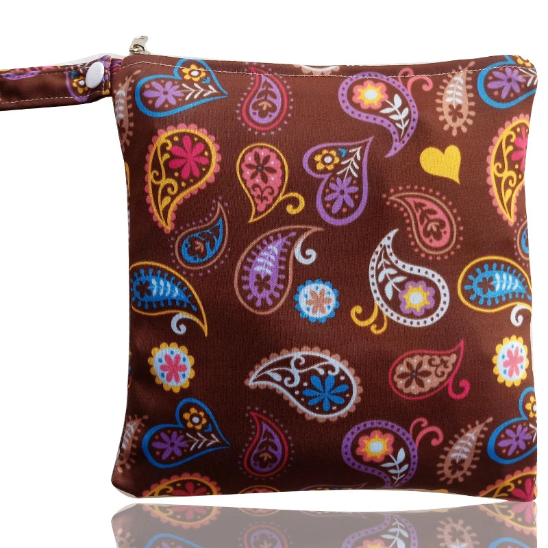 A reusable waterproof snack bag featuring a brown background with colorful paisley and floral patterns.
