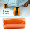Orange 8-pack of travel luggage wheel protectors with black and orange rubber grips