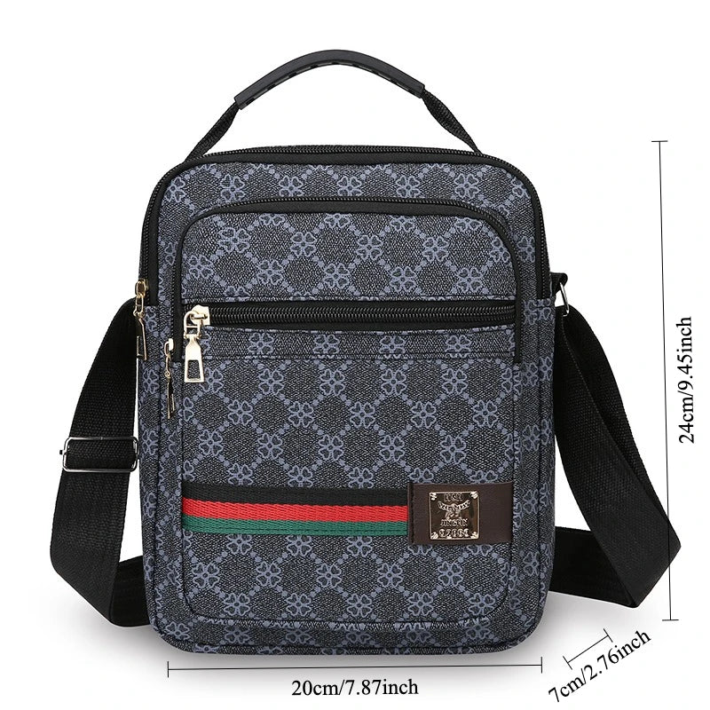 A black patterned sling bag with a black strap and a brown leather accent.