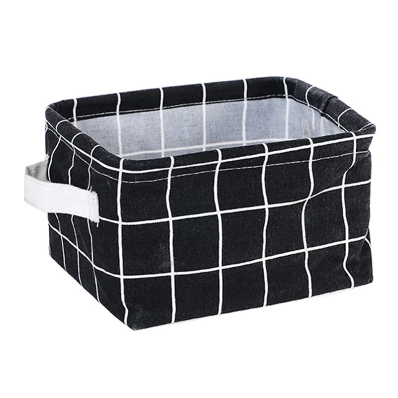 A black and white checkered foldable cotton linen storage basket with handles.