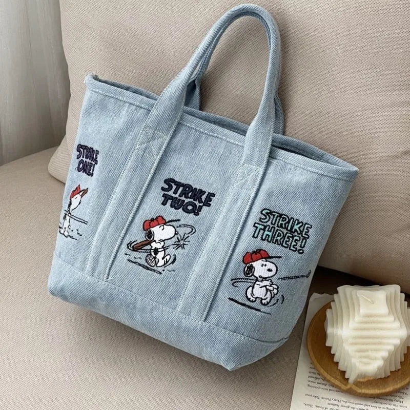 Light blue canvas shoulder bag featuring Snoopy cartoon graphics for women