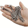 Silver metal chain strap with a clasp is held in a hand.