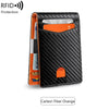 Black carbon fiber wallet with orange accents, showing a slim design for protection.