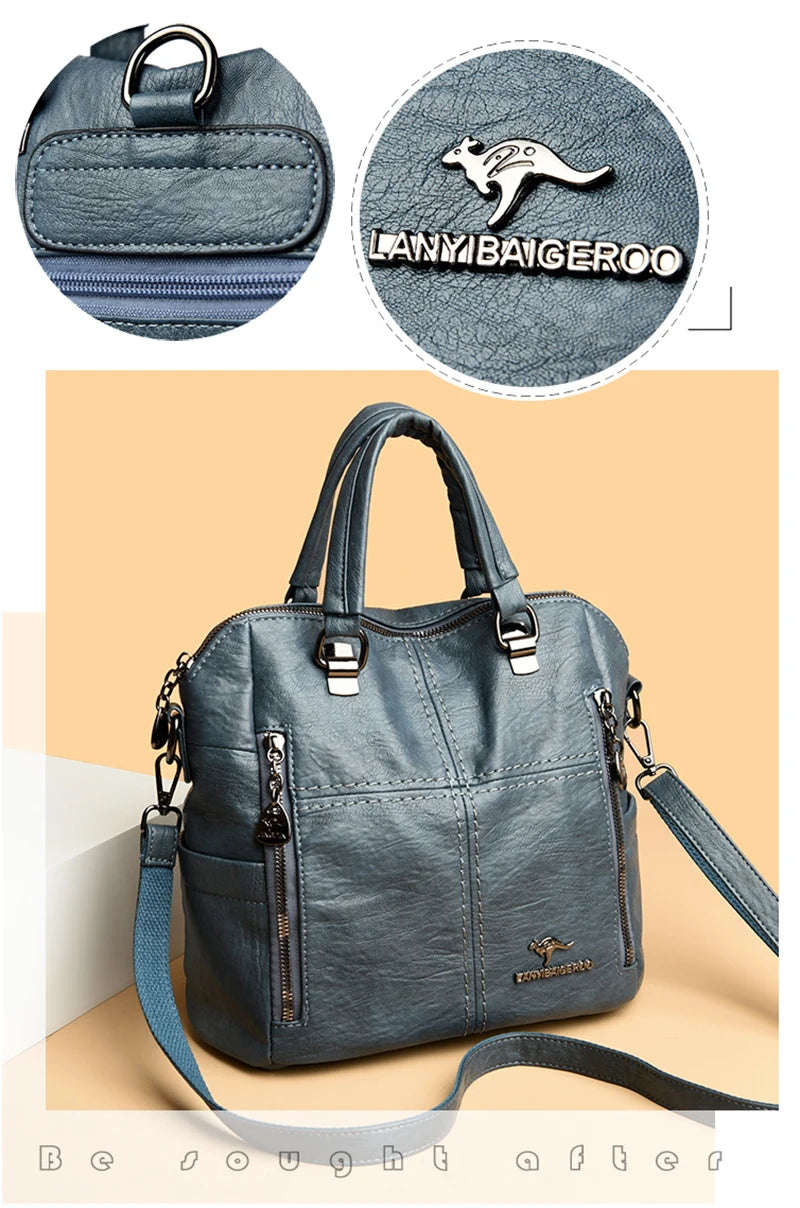 A dark gray leather crossbody backpack bag with silver hardware and a matching strap.