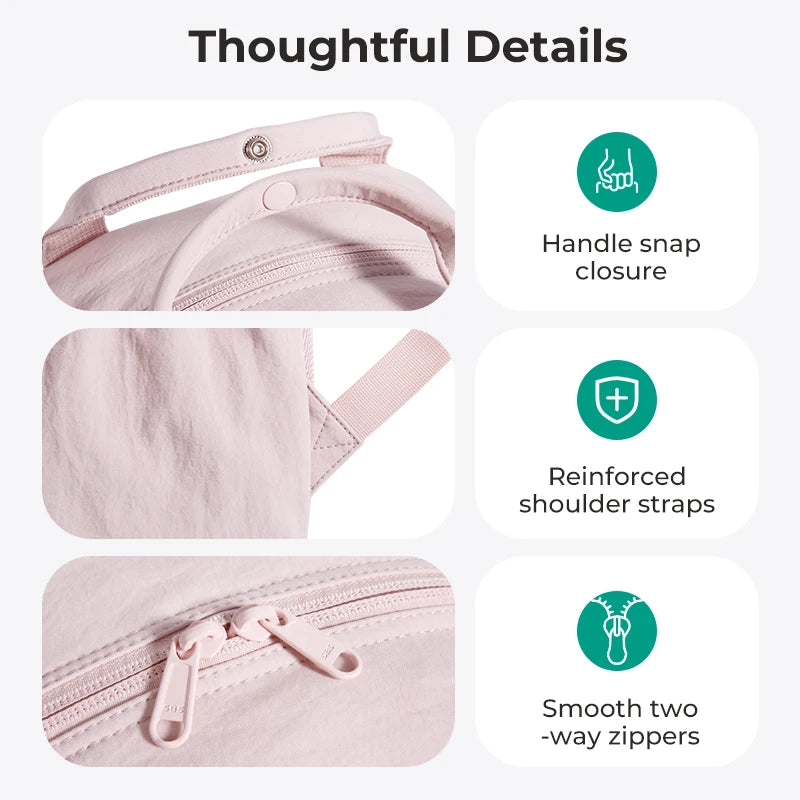 Close-up view of a pink women's lightweight backpack showing details like a handle snap closure, reinforced shoulder straps, 