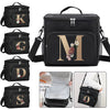 Black insulated canvas lunch bag featuring a gold initial monogram and dual handles.