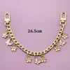 Goldkette mit kleinen rosa Blumenschnappschlüssen und Springerringen