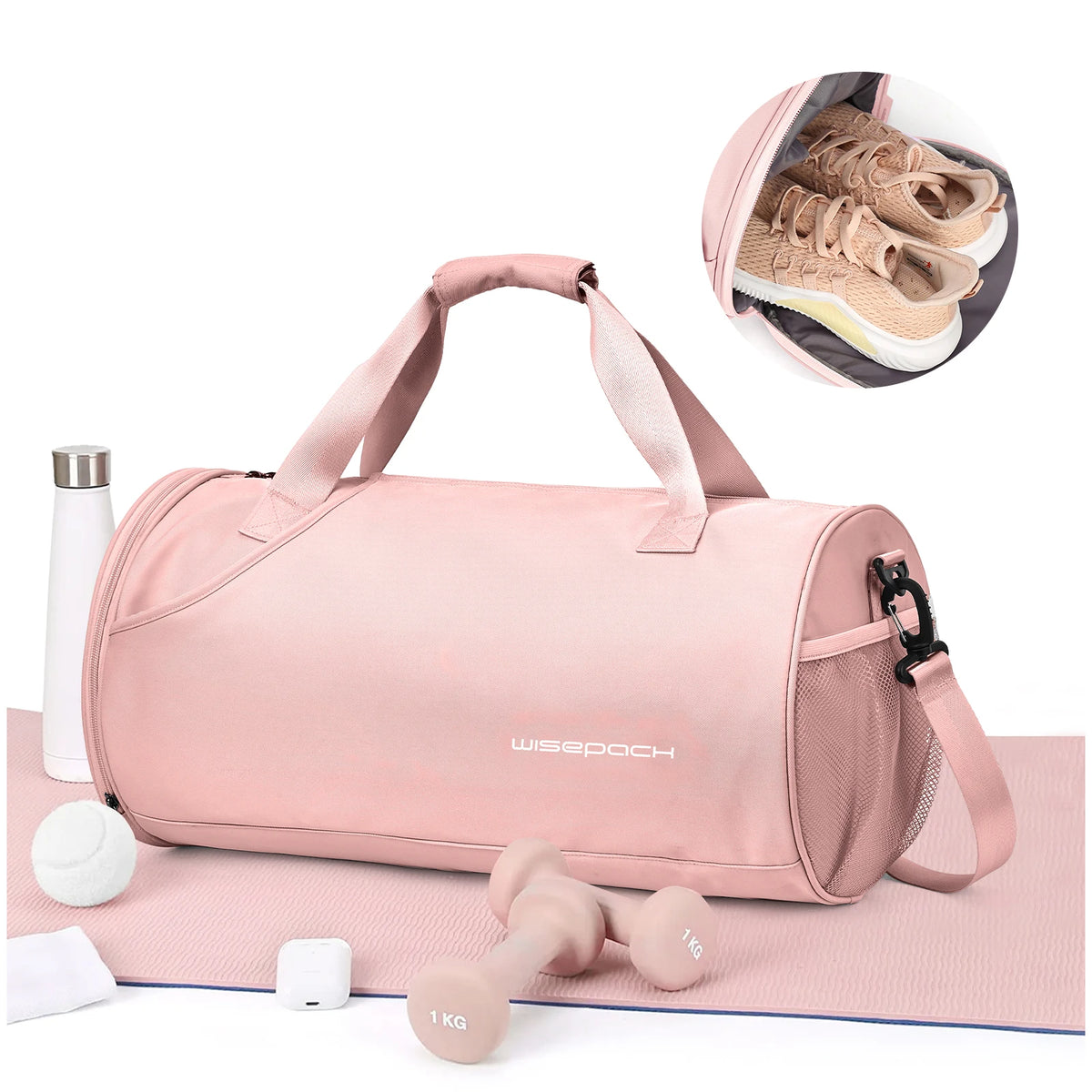 A pink waterproof travel duffel bag with a shoe compartment lying on a pink mat next to dumbbells.