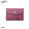A mauve pink genuine leather card holder with a gold stud closure.