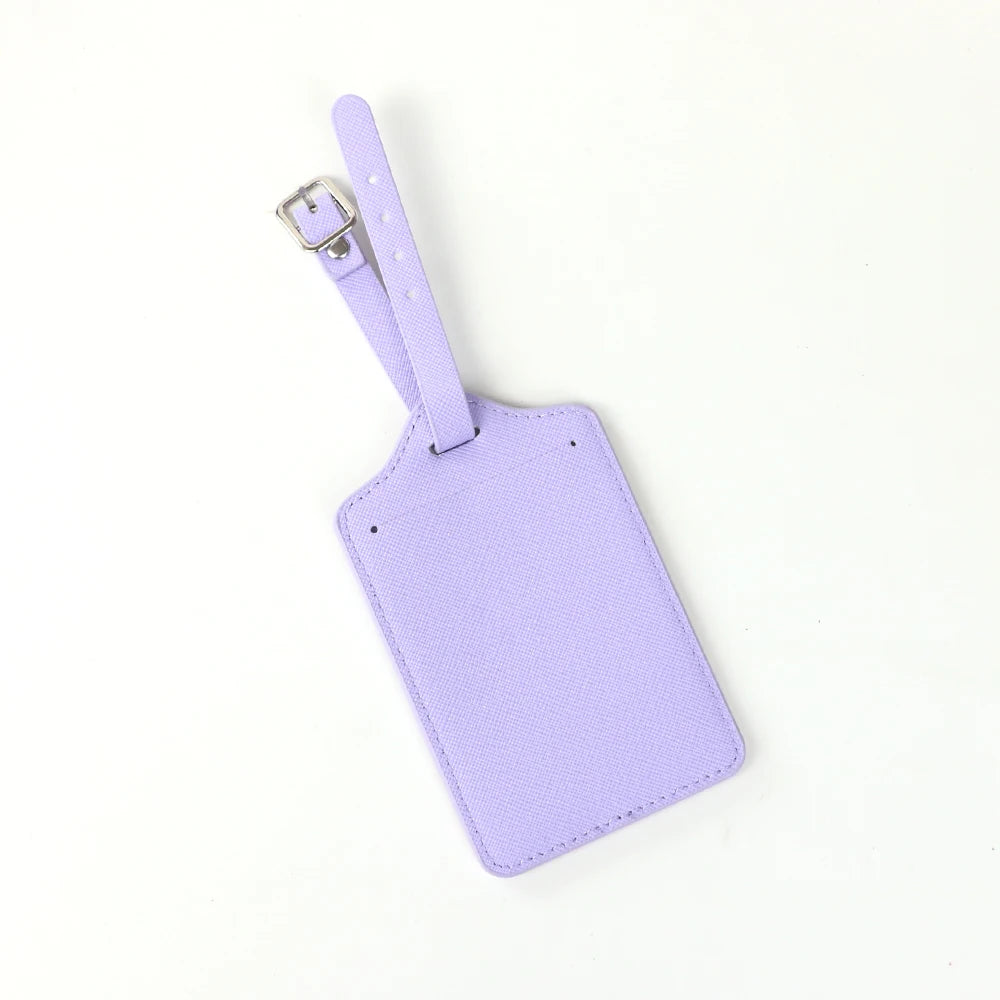 A purple PU leather luggage tag with a silver clip attached to a strap.
