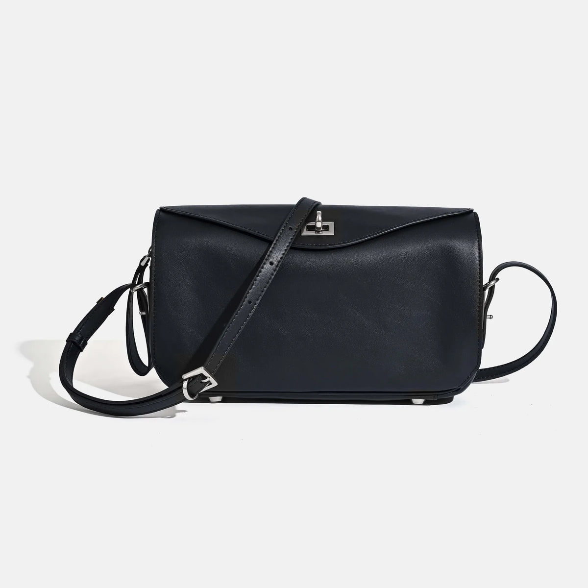 A black genuine leather square shoulder crossbody bag with a thin strap and a silver logo detail.