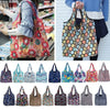 A collection of reusable eco tote shopping bags in various floral and patterned fabrics.
