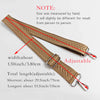 A close-up of a tan arrow jacquard pattern handbag strap showing adjustable length options.