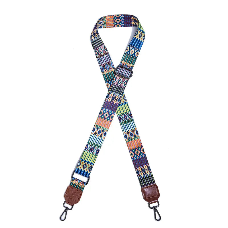 A colorful retro textile replacement bag strap with geometric patterns and leather ends.