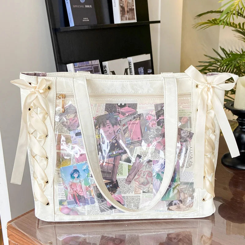 A cream colored transparent shoulder tote bag with a floral print and satin ribbon details.