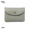 A light grey genuine leather card holder or coin purse with a gold-toned stud closure.