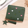 A dark olive green PU leather wallet with a zipper closure decorated with small pink and green heart shapes and attached to a