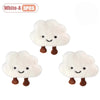 Three white cloud-shaped plush keychains or brooch pins.
