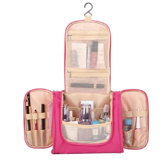 Pink multi-compartment travel pouch with floral print for organizing cosmetics and toiletries