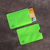 A bright lime green anti-scan card sleeve is shown next to a yellow credit card and an RFID protection card.