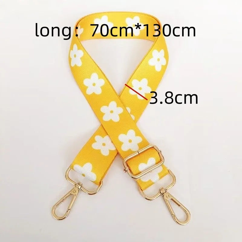 Yellow nylon strap with a floral pattern, measuring 70cm by 130cm, featuring gold-colored hardware.