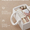 A white flannel diaper caddy organizer filled with baby essentials like diapers and creams.