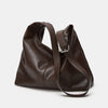 A dark brown soft PU leather retro tote bag with a zipper closure shown from the side.
