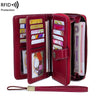 A maroon RFID protection multi-card wallet with a wrist strap, showing various cards inside.