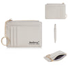 A light beige leather card holder wallet with vertical stitching and a gold chain keychain.