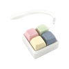 A white tactile stress relief keyboard fidget toy with five colored silicone keys inside.