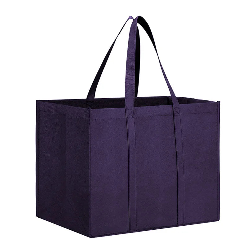 A dark purple reusable foldable grocery tote bag with black handles.