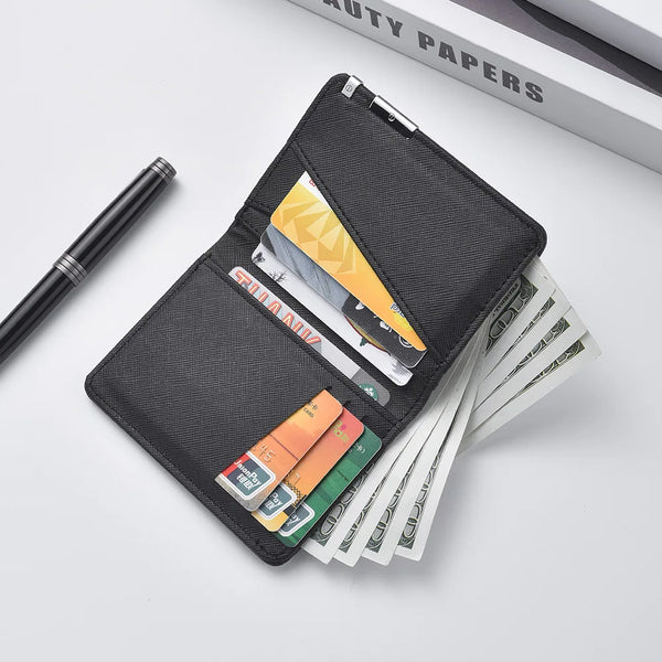 A black slim vertical men's card wallet is shown open, displaying various cards and a pen on a white surface.