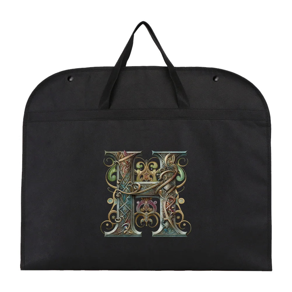 Black fabric dust cover and storage bag with an ornate gold letter H design