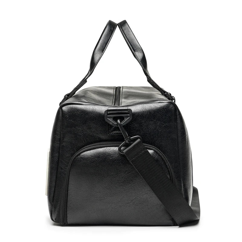 Black leather travel duffle bag with padded straps and a flap closure