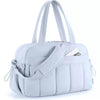 A light gray versatile large capacity travel and fitness bag with white handles.