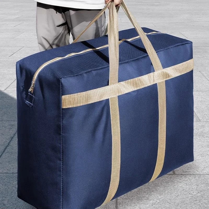 A navy blue foldable waterproof storage bag with tan straps is shown being carried.