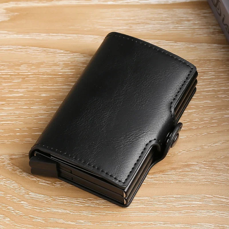 A black premium double layer ID card holder wallet lying on a light wooden surface.