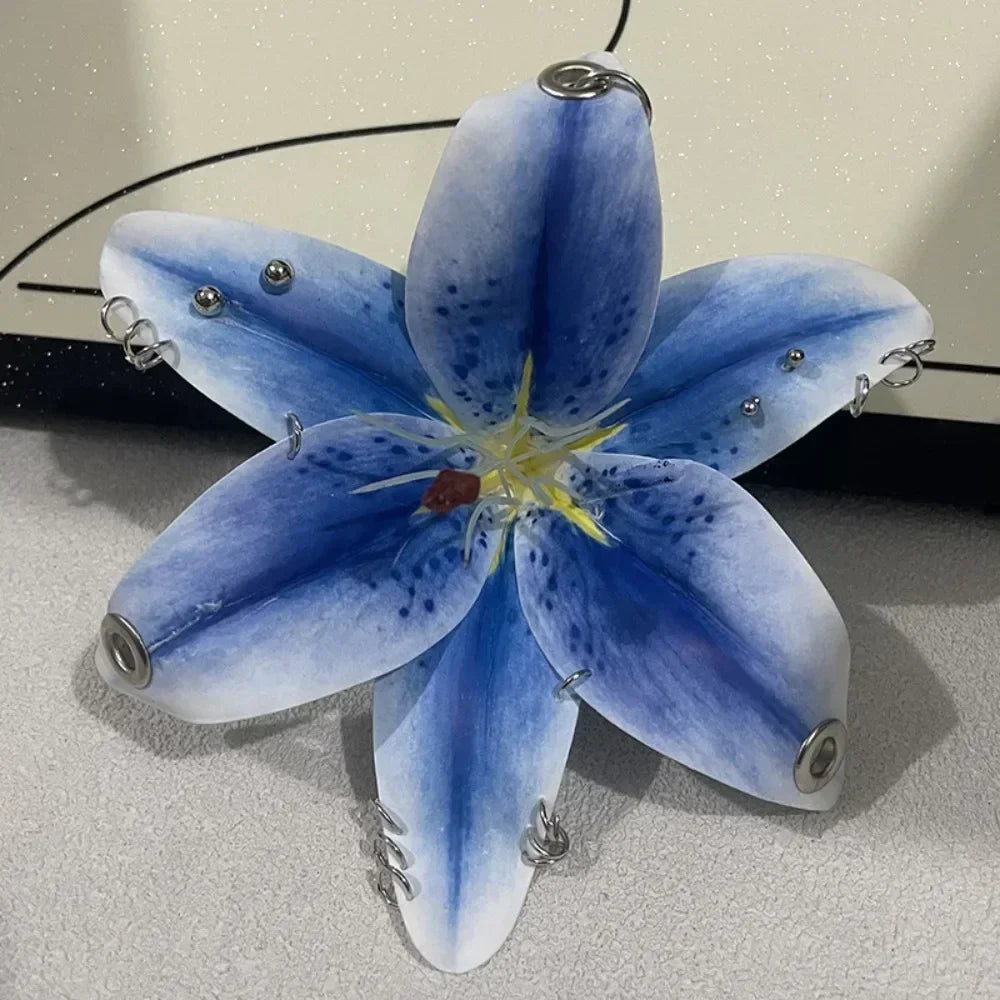 A realistic blue Phalaenopsis orchid flower keychain with yellow center and silver findings.