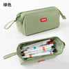 A light green minimalist pencil case with a zipper and a label holder is shown in a top-down view.