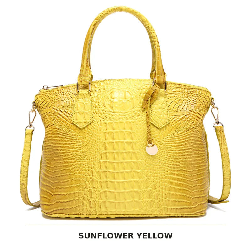 Gelbe krokodillenmuster-Top mit Henkel und Crossbody-Tasche.